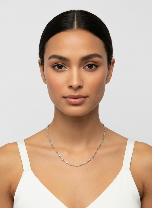 Silver chain necklace on a white background