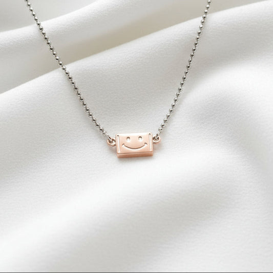 Necklace with a small brown leather tag pendant on a white background