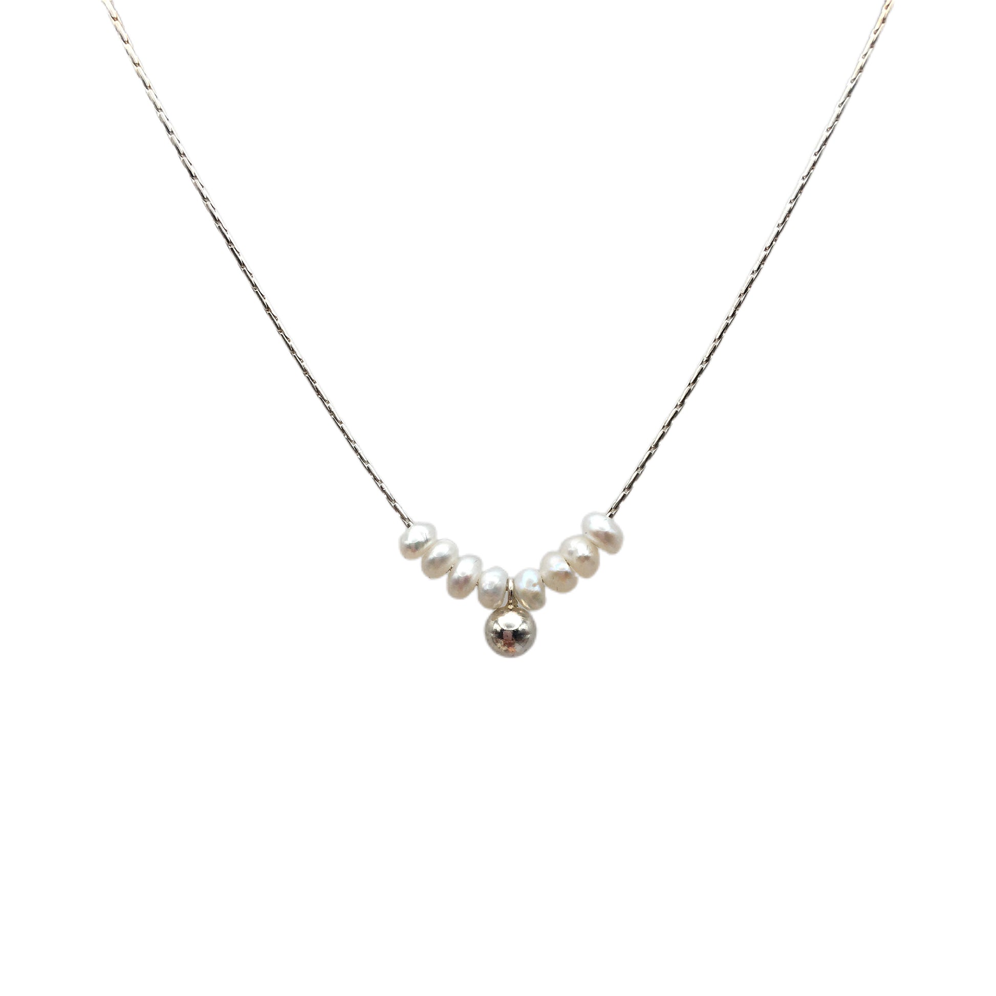 Necklace with pearls and a silver ball on a white background