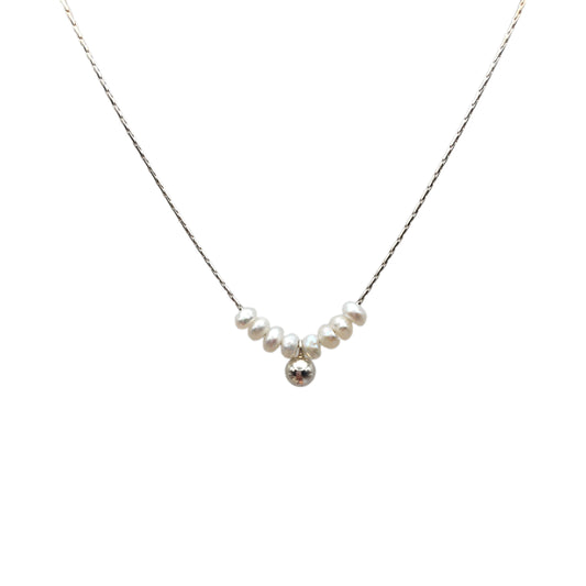 Necklace with pearls and a silver ball on a white background