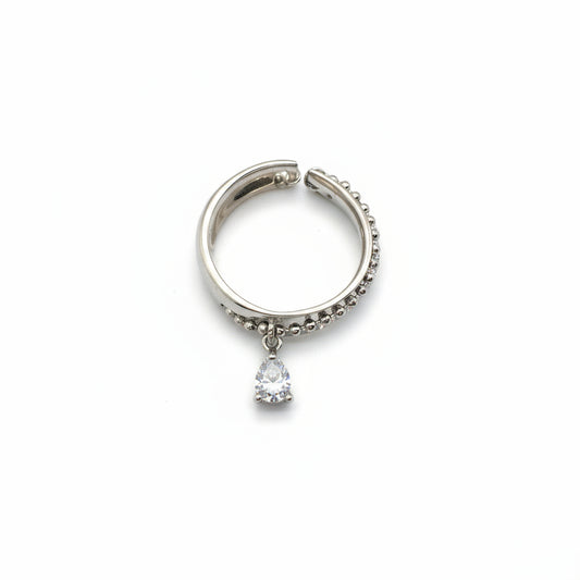 Silver hoop earring with a small gemstone on a white background