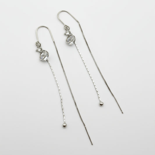 Pair of silver threader earrings on a white background