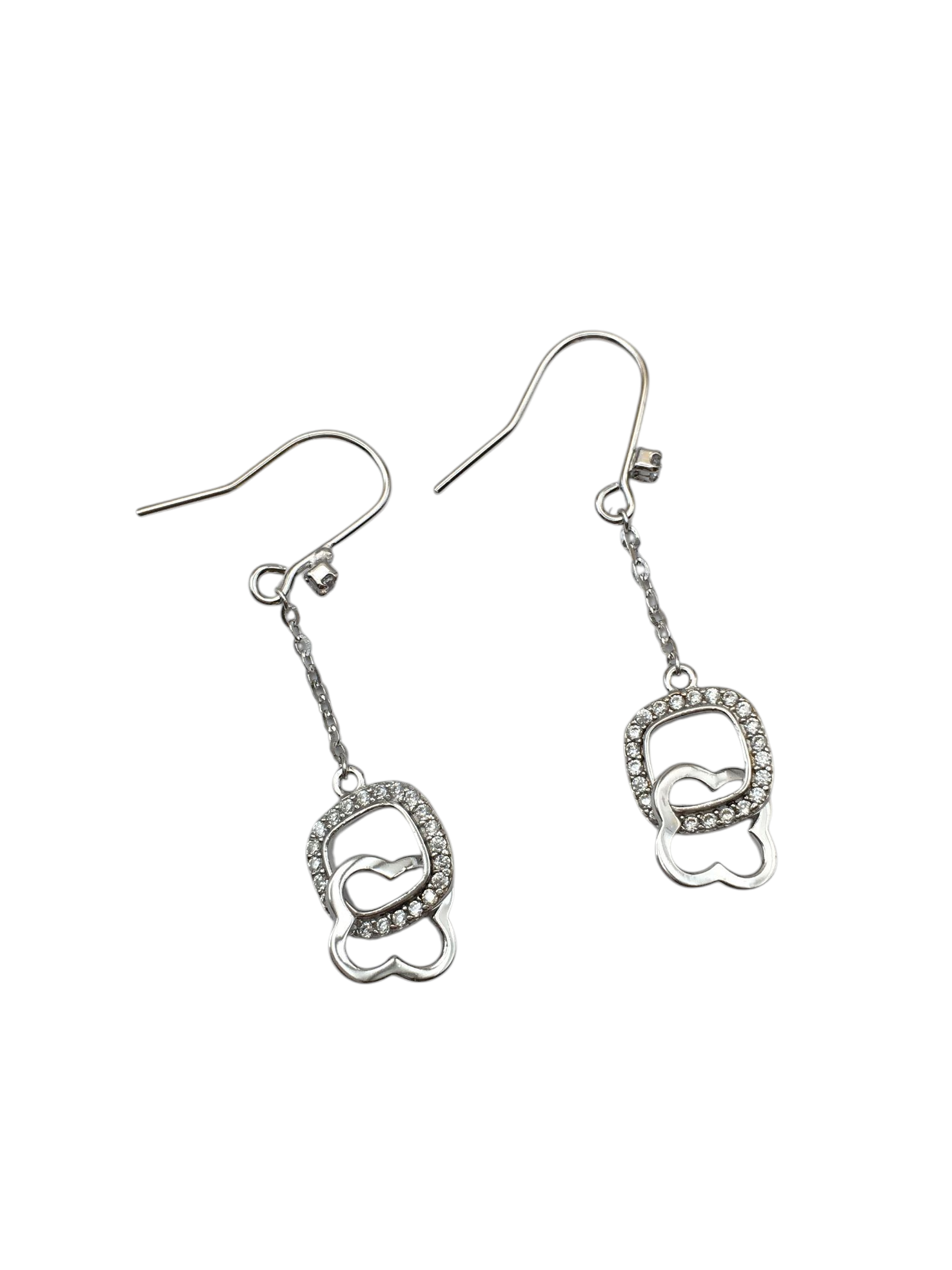 Pair of silver earrings with heart designs on a white background