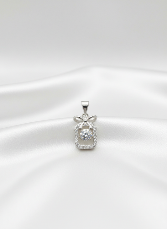 silver pendant with diamond accents on a white background
