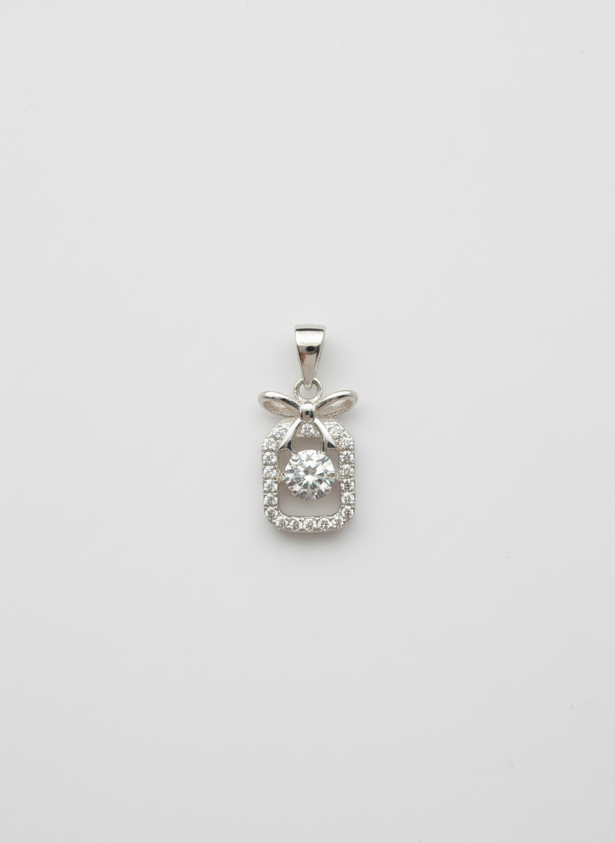 Silver pendant with diamonds on a white background