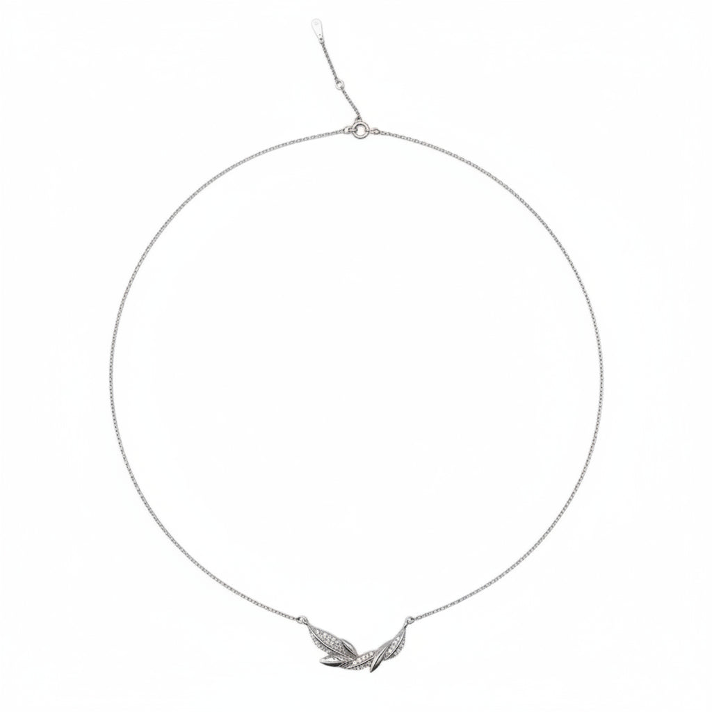 Silver necklace with a feather pendant on a white background