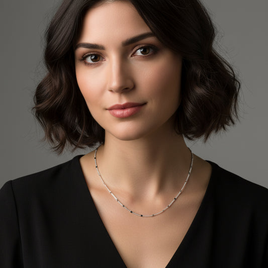 Silver chain necklace on a white background