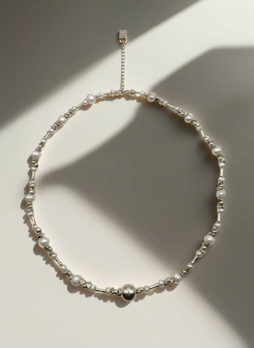 Necklace with pearls and beads on a white background