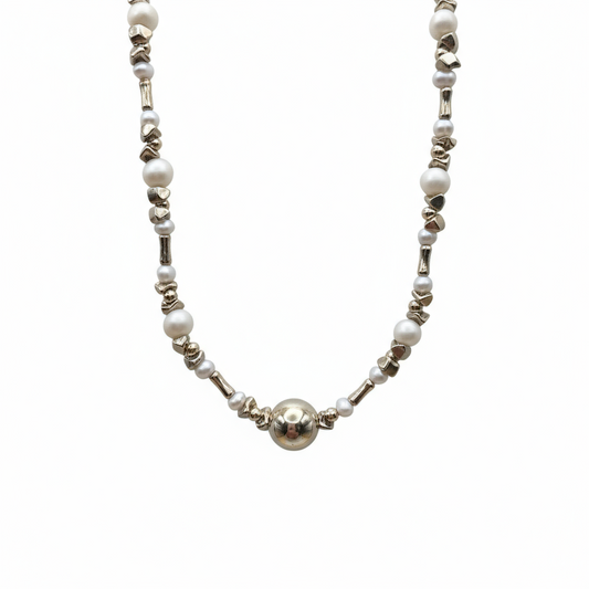 Necklace with pearls and silver beads on a white background