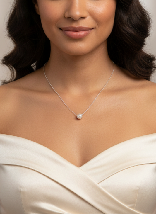 Necklace with a single pearl pendant on a white background