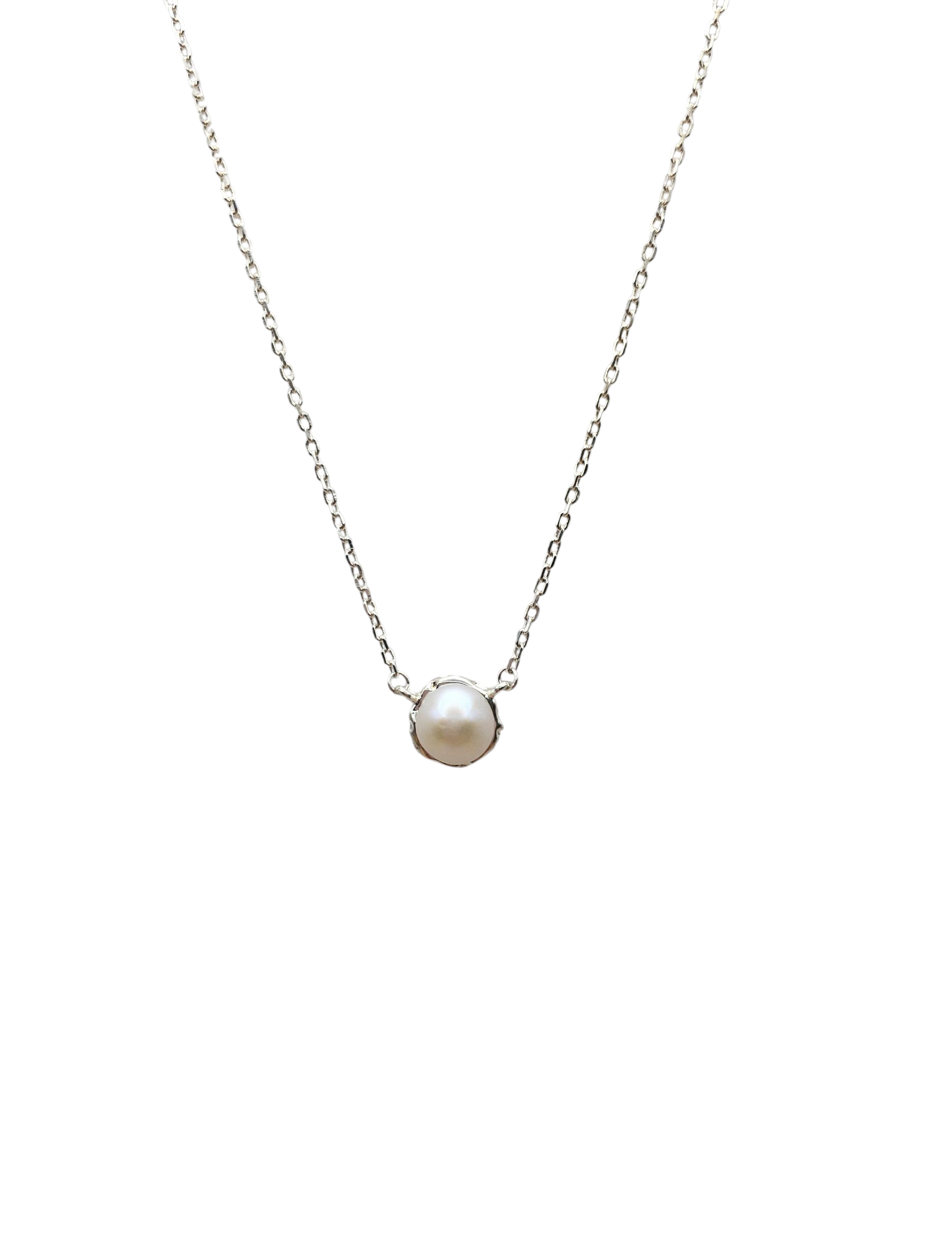 Pearl necklace on a thin chain against a white background