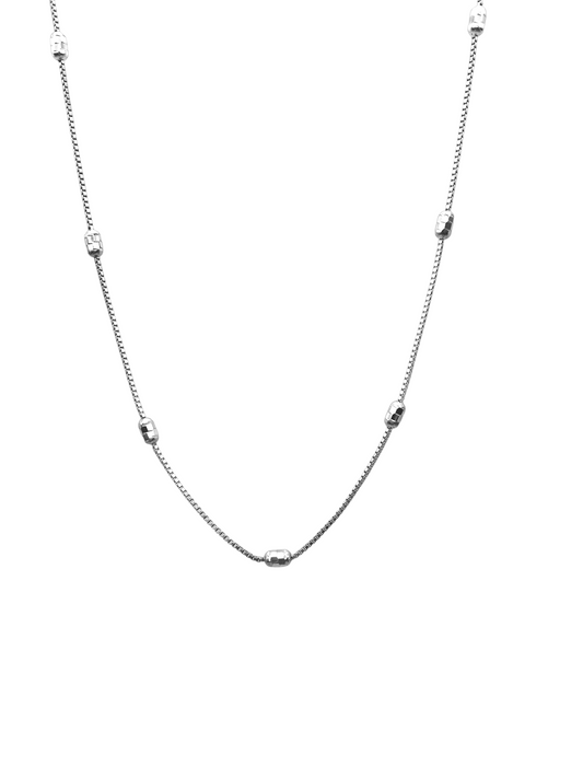 Silver chain necklace on a white background