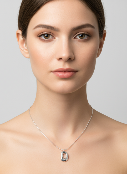 Silver necklace with a pendant on a white background