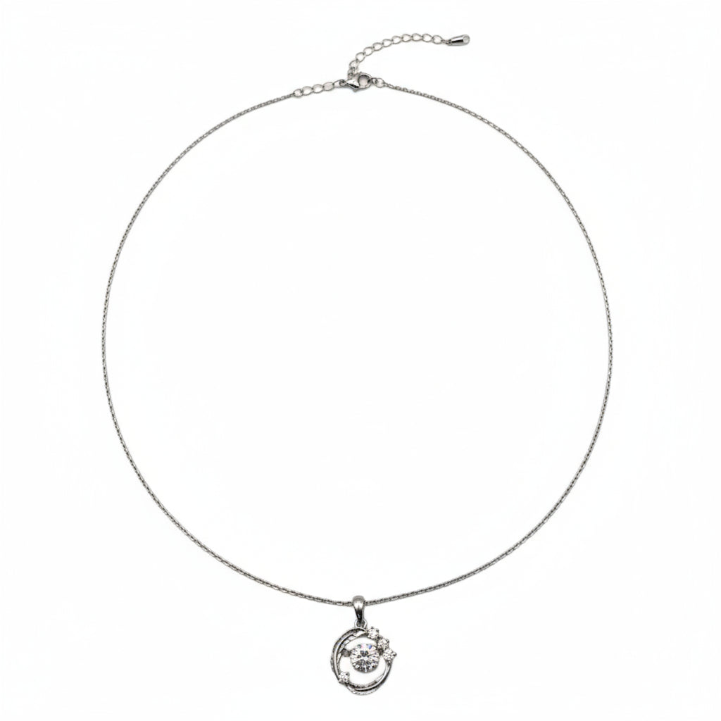 Silver necklace with a small round pendant on a white background