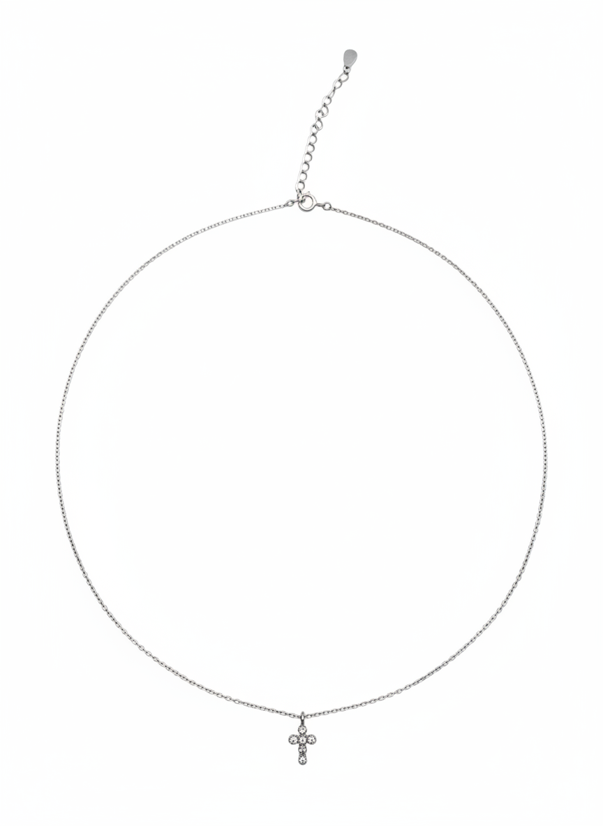 Silver necklace with a small cross pendant on a white background