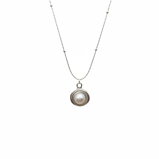Necklace with a pearl pendant on a white background