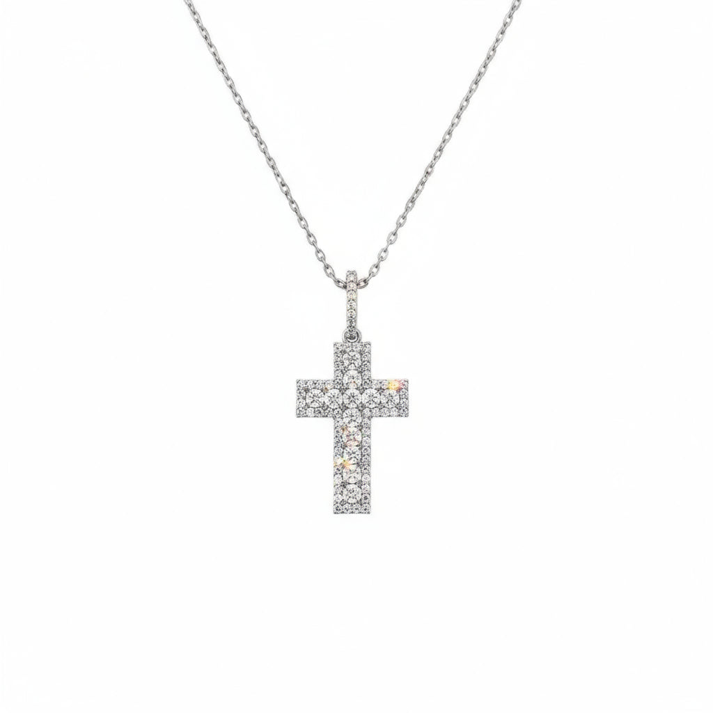 Silver cross necklace on a white background