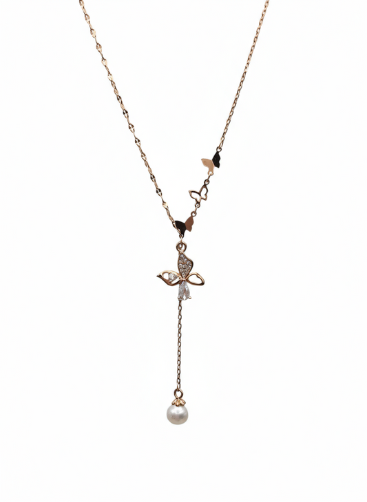 Delicate necklace with a small pendant and pearl drop on a white background