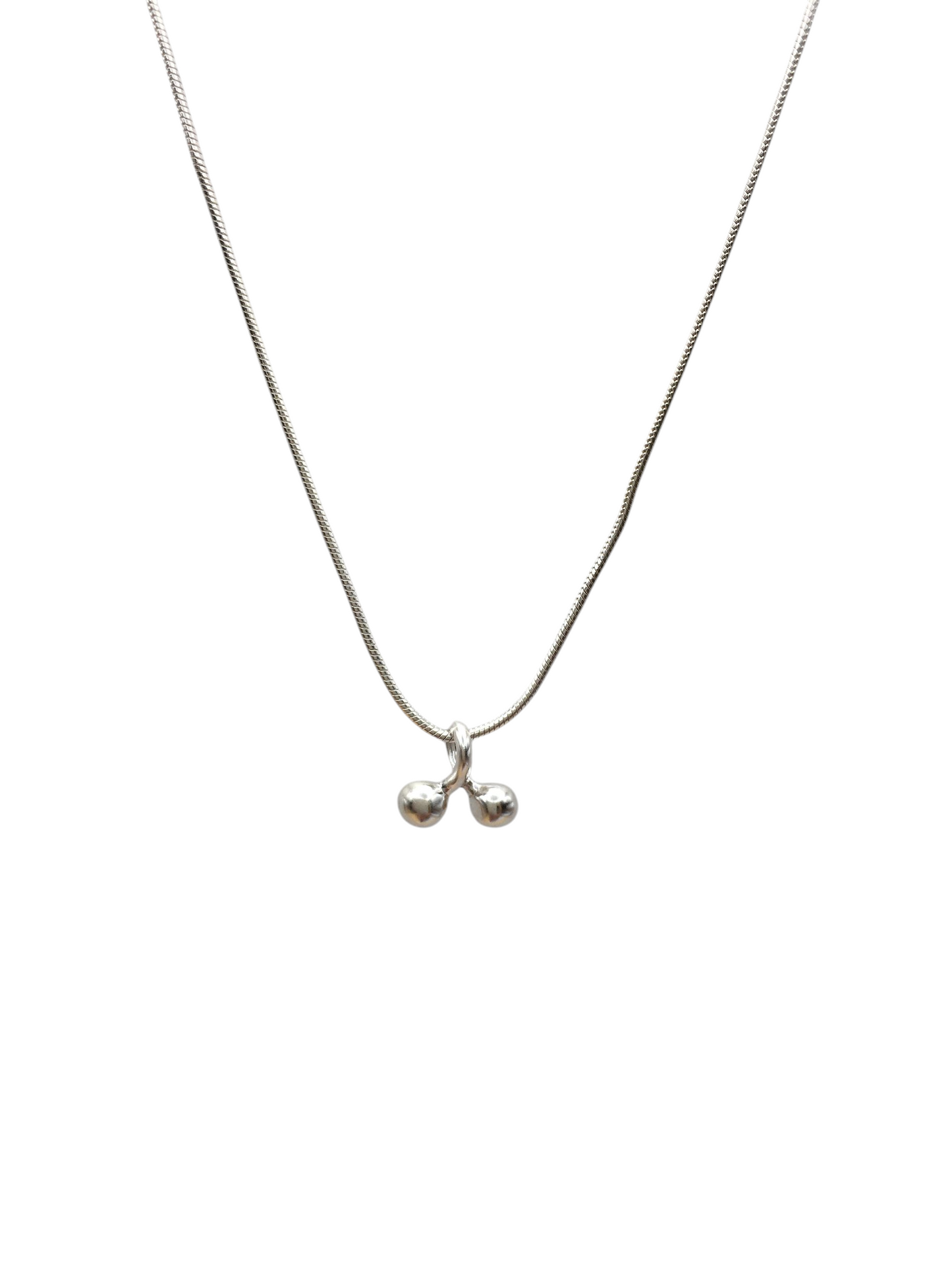 Silver necklace with a small pendant on a white background