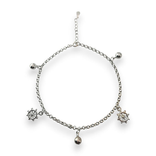 Silver bracelet with charms on a white background