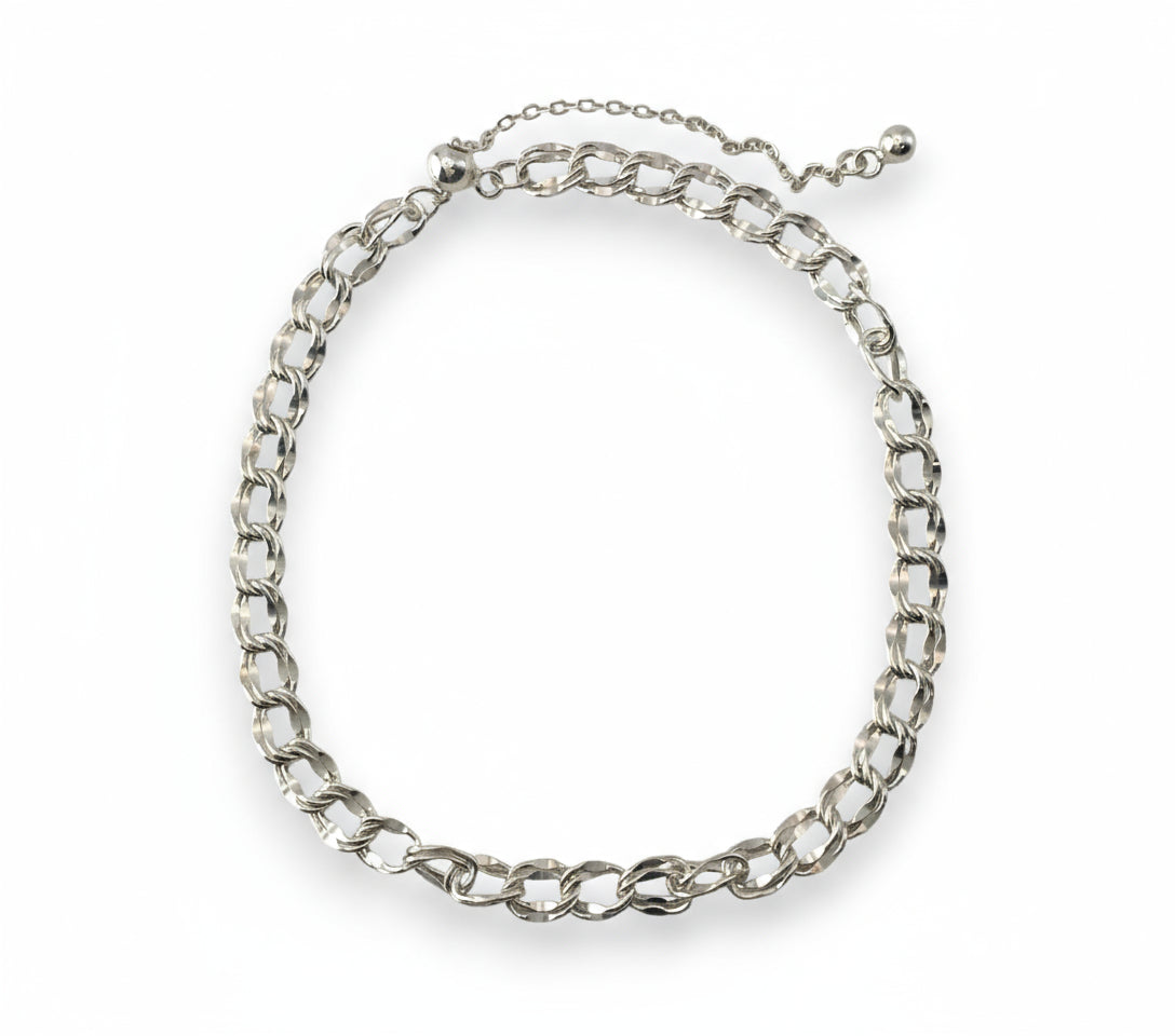 Silver chain bracelet on a white background