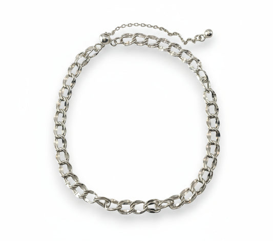 Silver chain bracelet on a white background