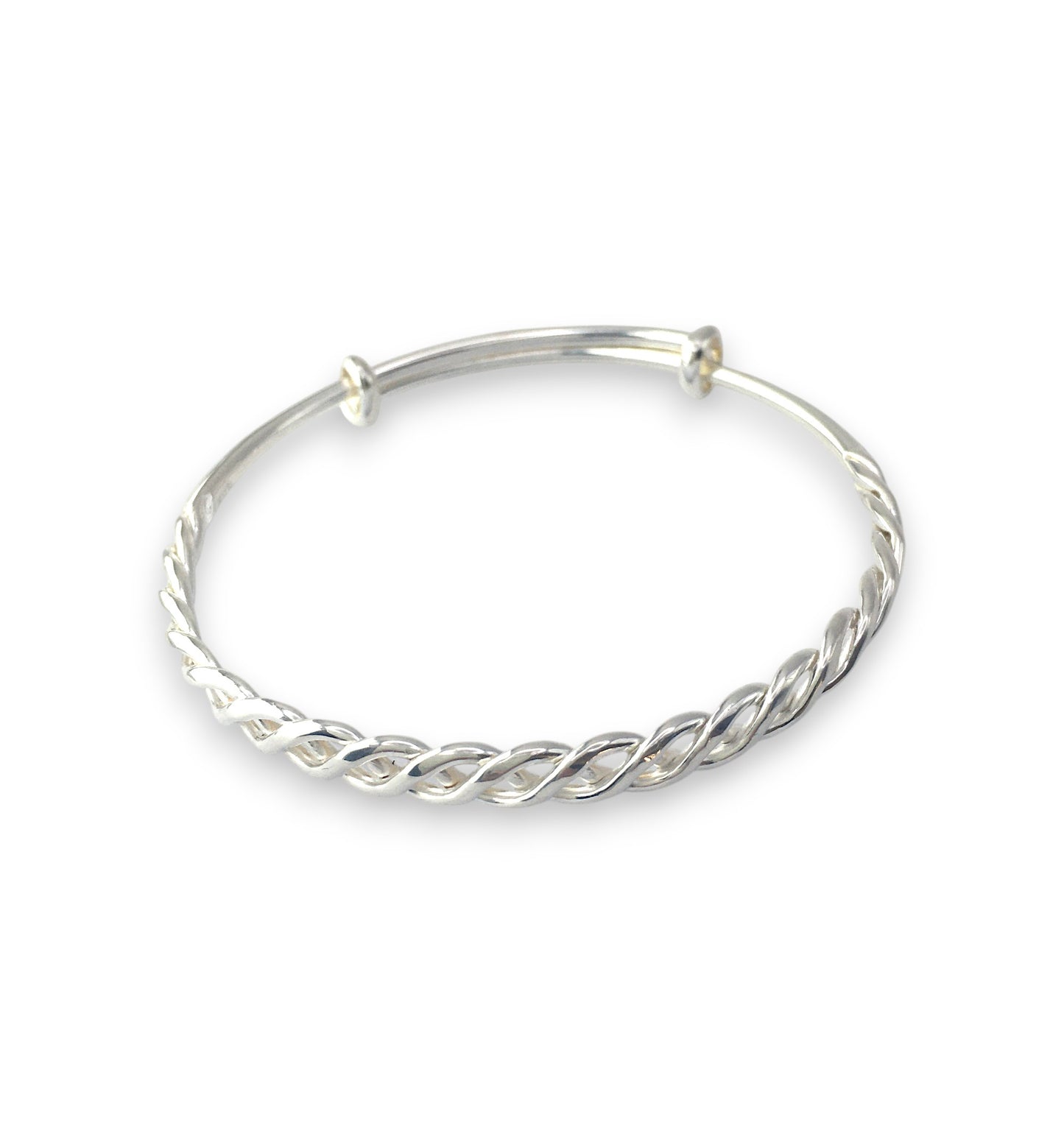 Silver bangle with a twisted design on a white background