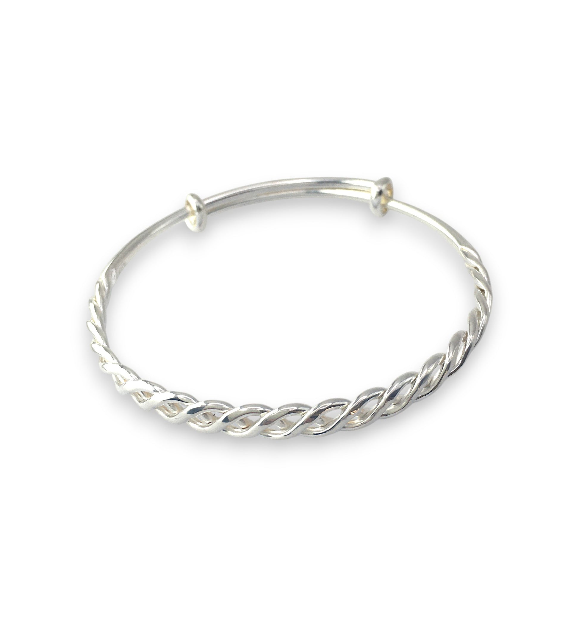 Silver bangle with a twisted design on a white background