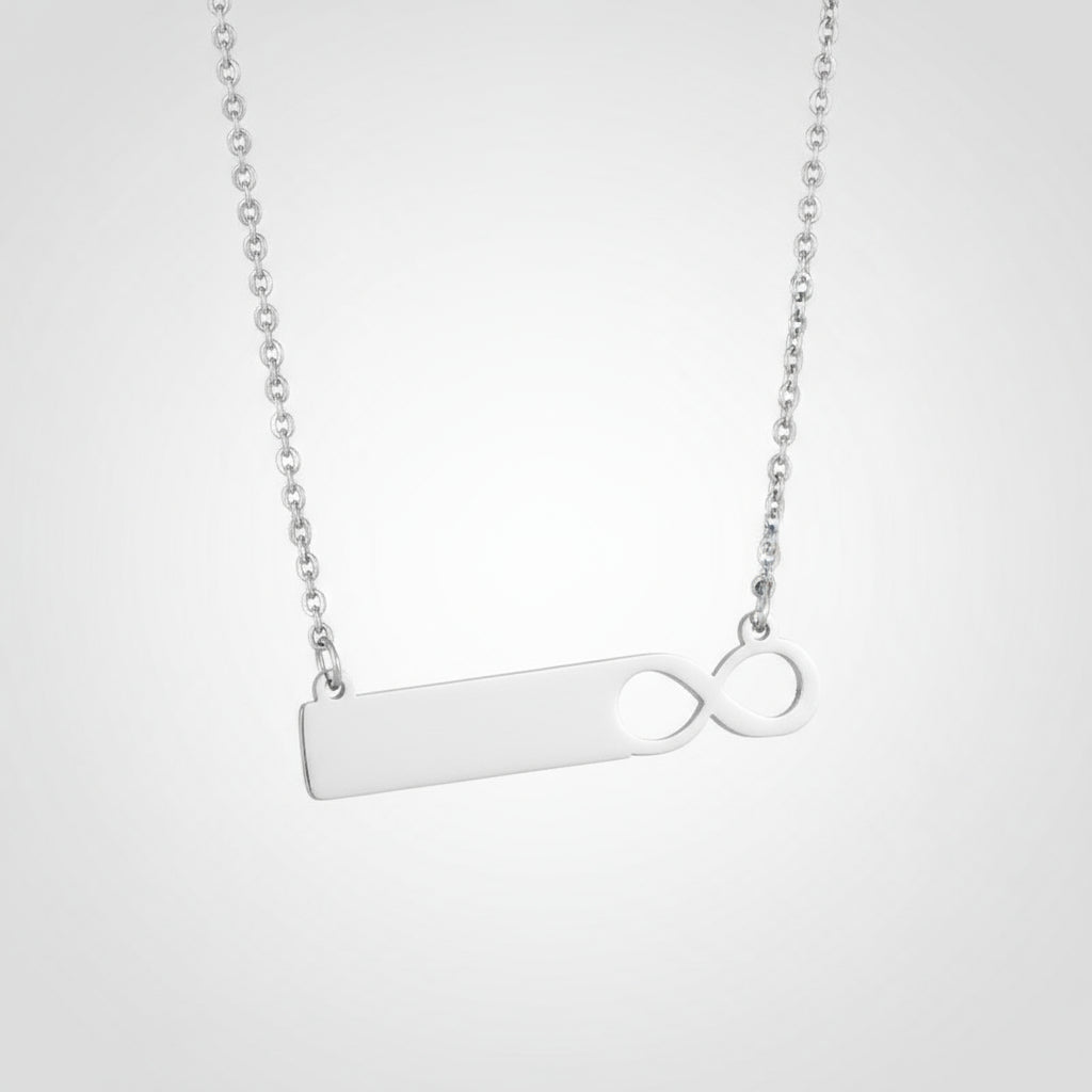 Silver necklace with a unique pendant design on a white background
