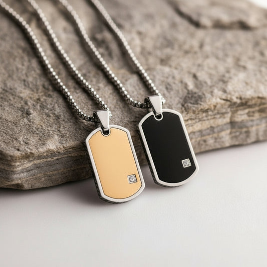 Two dog tags on chains with a wooden block background