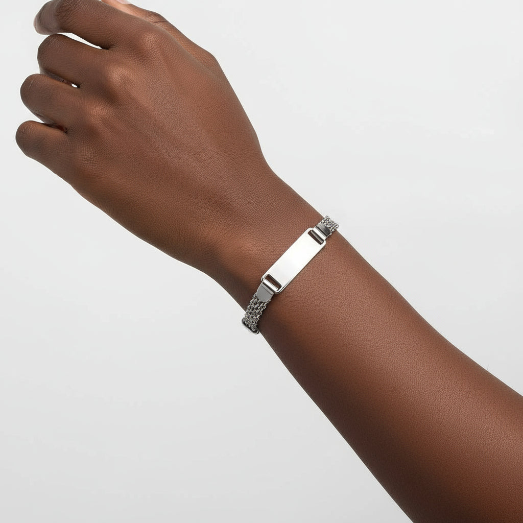 Silver bracelet with a chain design on a white background