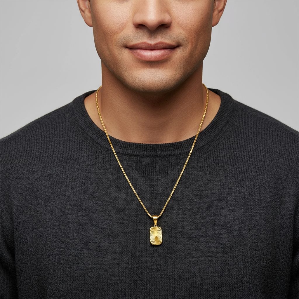 Gold necklace with a pendant on a white background