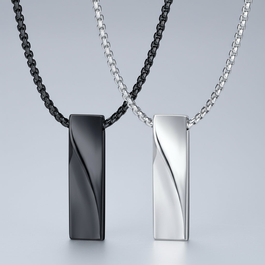 Two necklaces with black and silver pendants on a white background