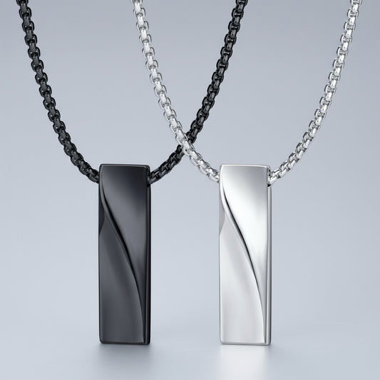 Two necklaces with black and silver pendants on a white background