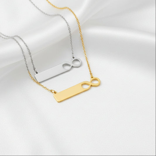 Gold necklace with a unique pendant on a white background