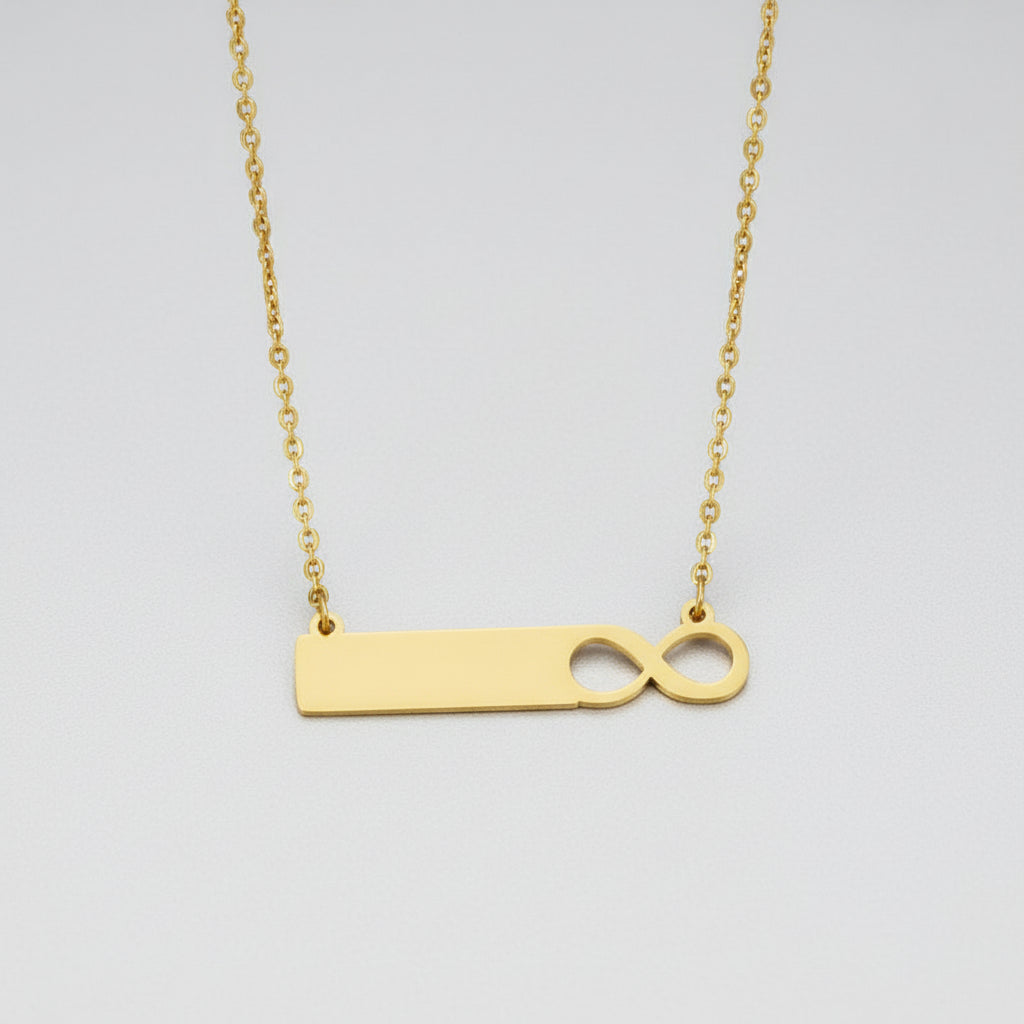 Gold necklace with a unique pendant on a white background