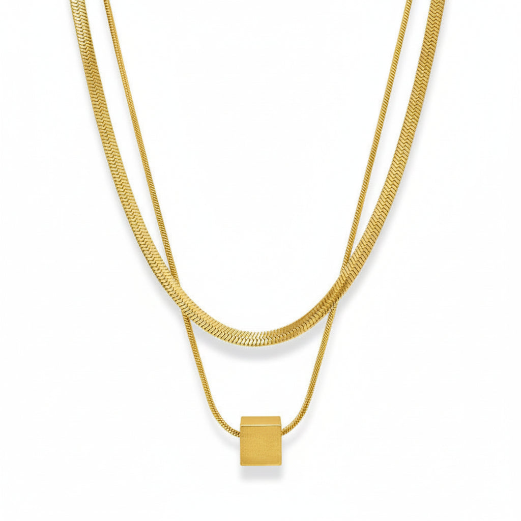 Two silver necklaces with square pendants on a white background