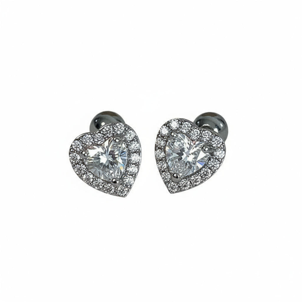 Pair of heart-shaped diamond earrings on a white background