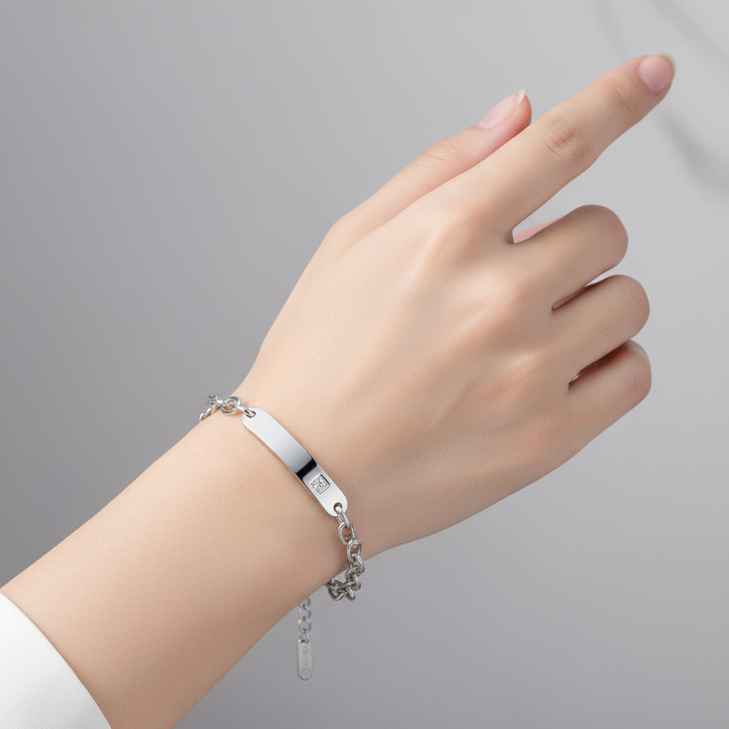 Silver chain bracelet with a diamond on an white background