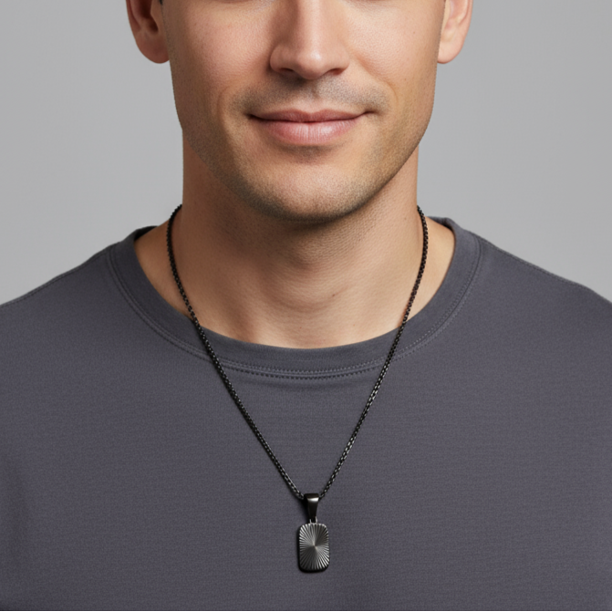 Black chain necklace with a pendant on a white background