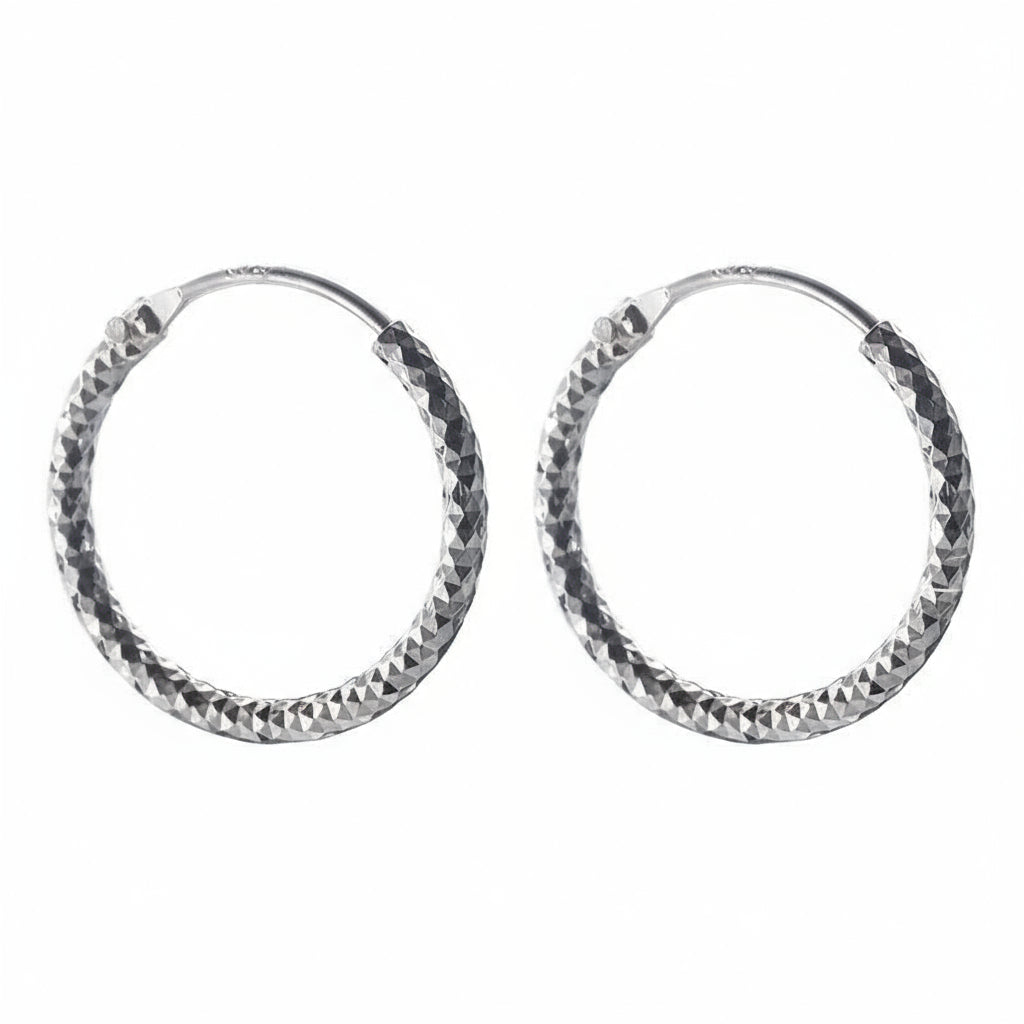 Pair of silver hoop earrings with a textured finish on a white background