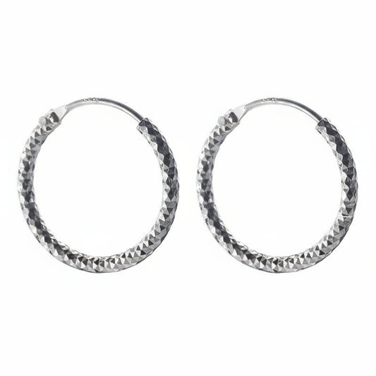 Pair of silver hoop earrings with a textured finish on a white background