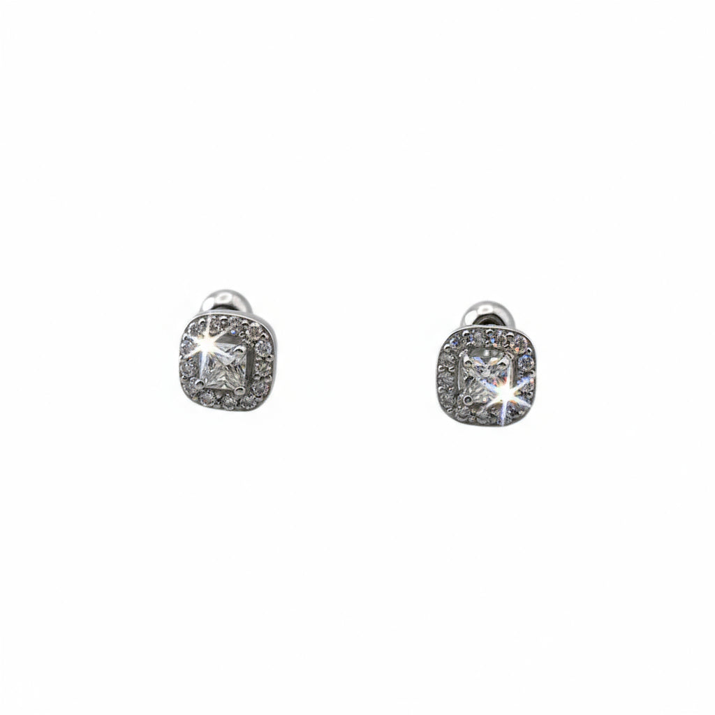 Pair of silver earrings with gemstones on a white background