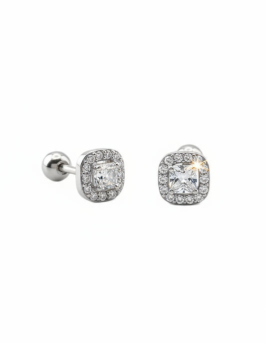 Pair of silver earrings with cubic zirconia on a white background