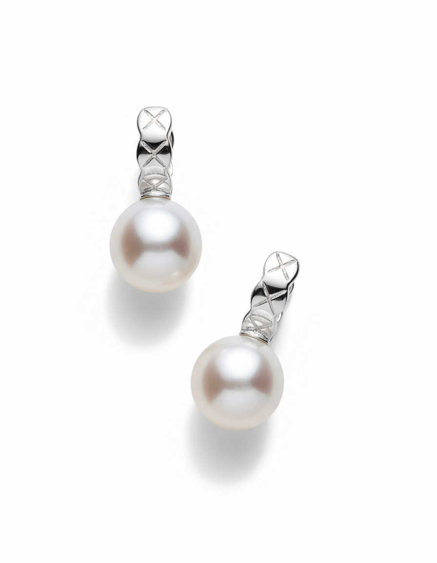 Pair of pearl earrings with silver hooks on a white background