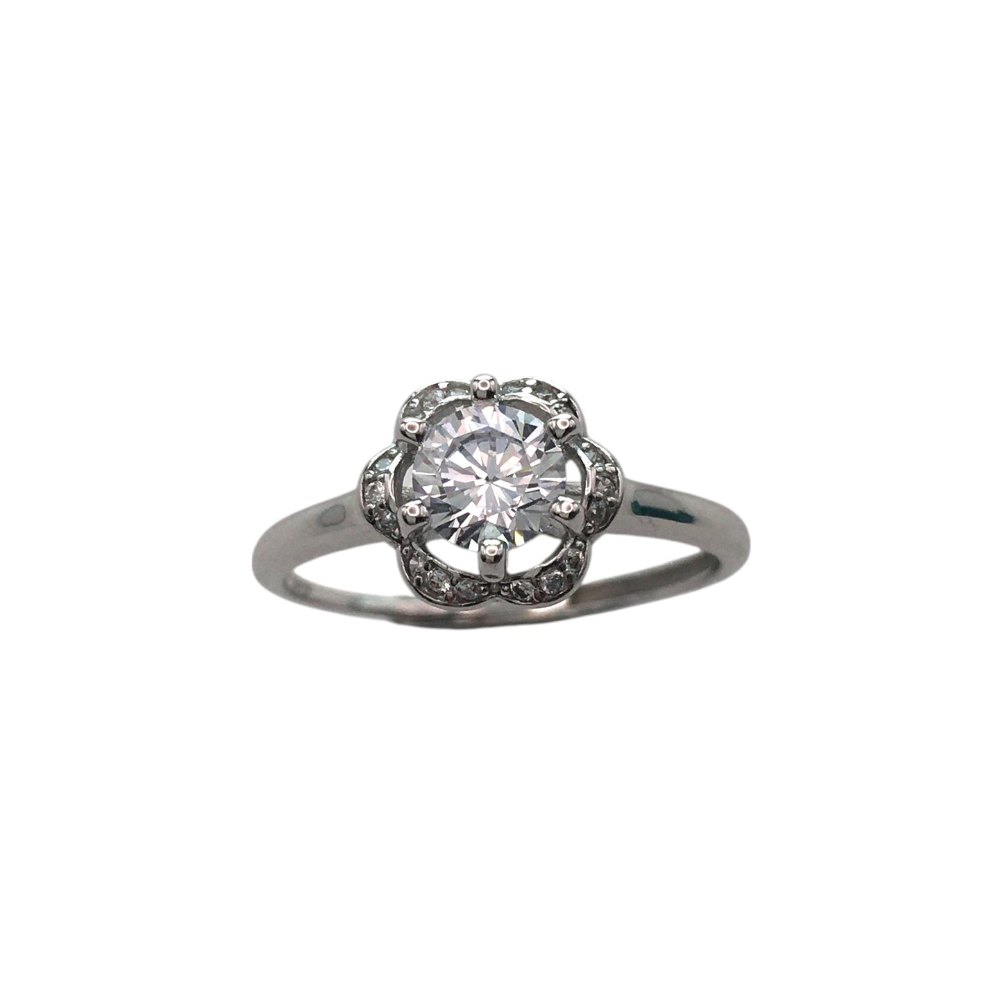 Diamond ring with a halo setting on a white background