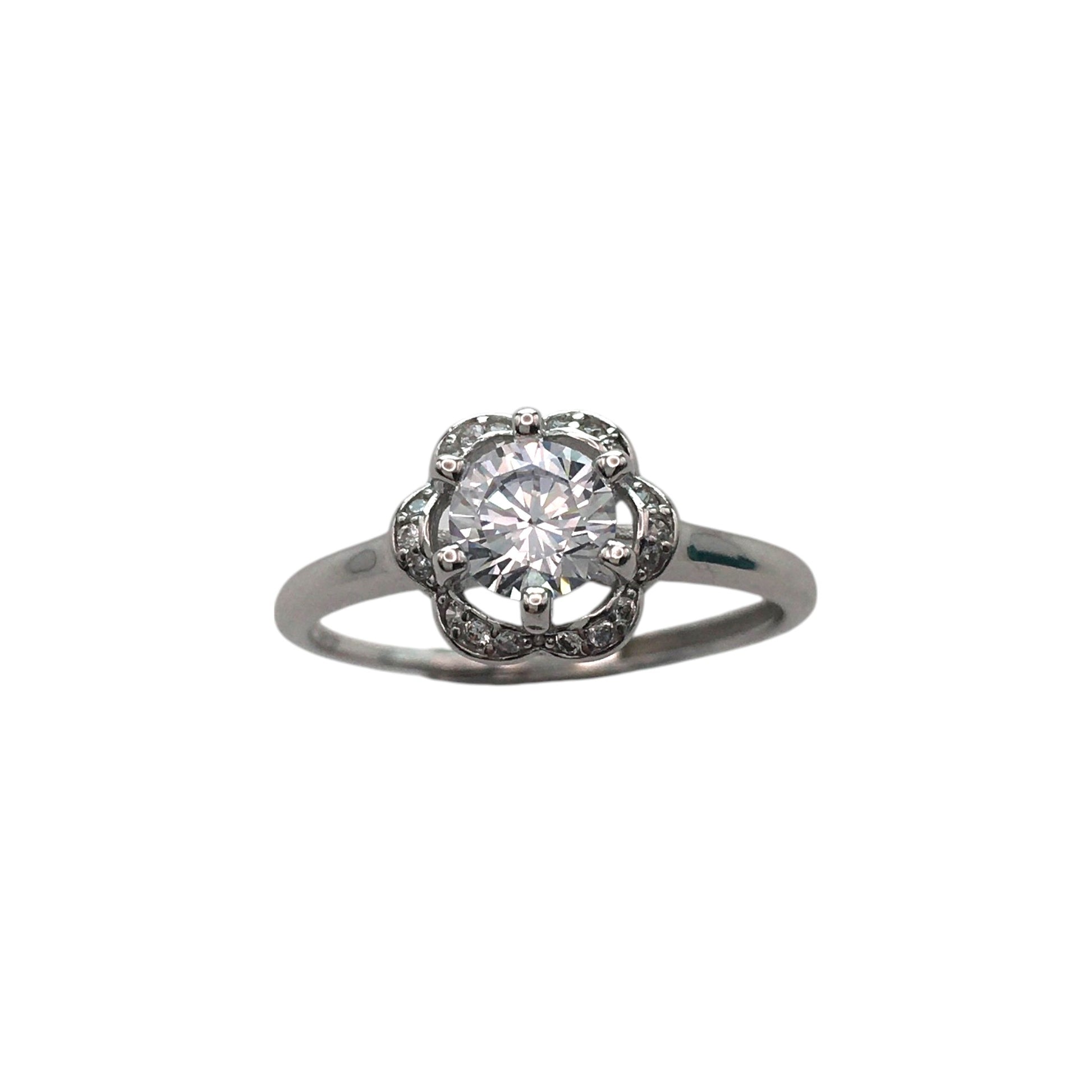 Diamond ring with a halo setting on a white background