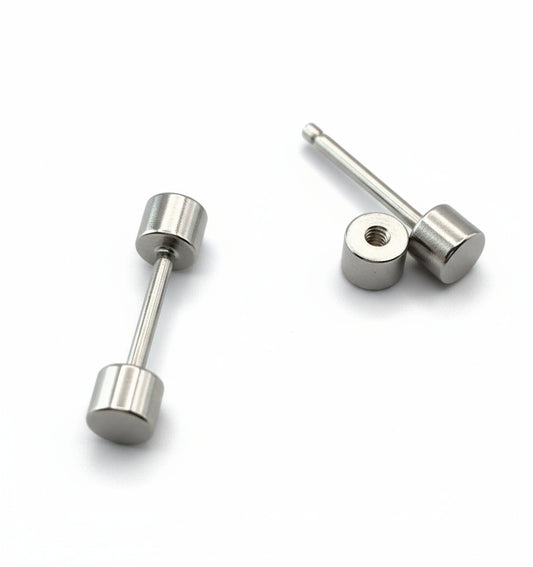 Pair of silver stud earrings on a white background