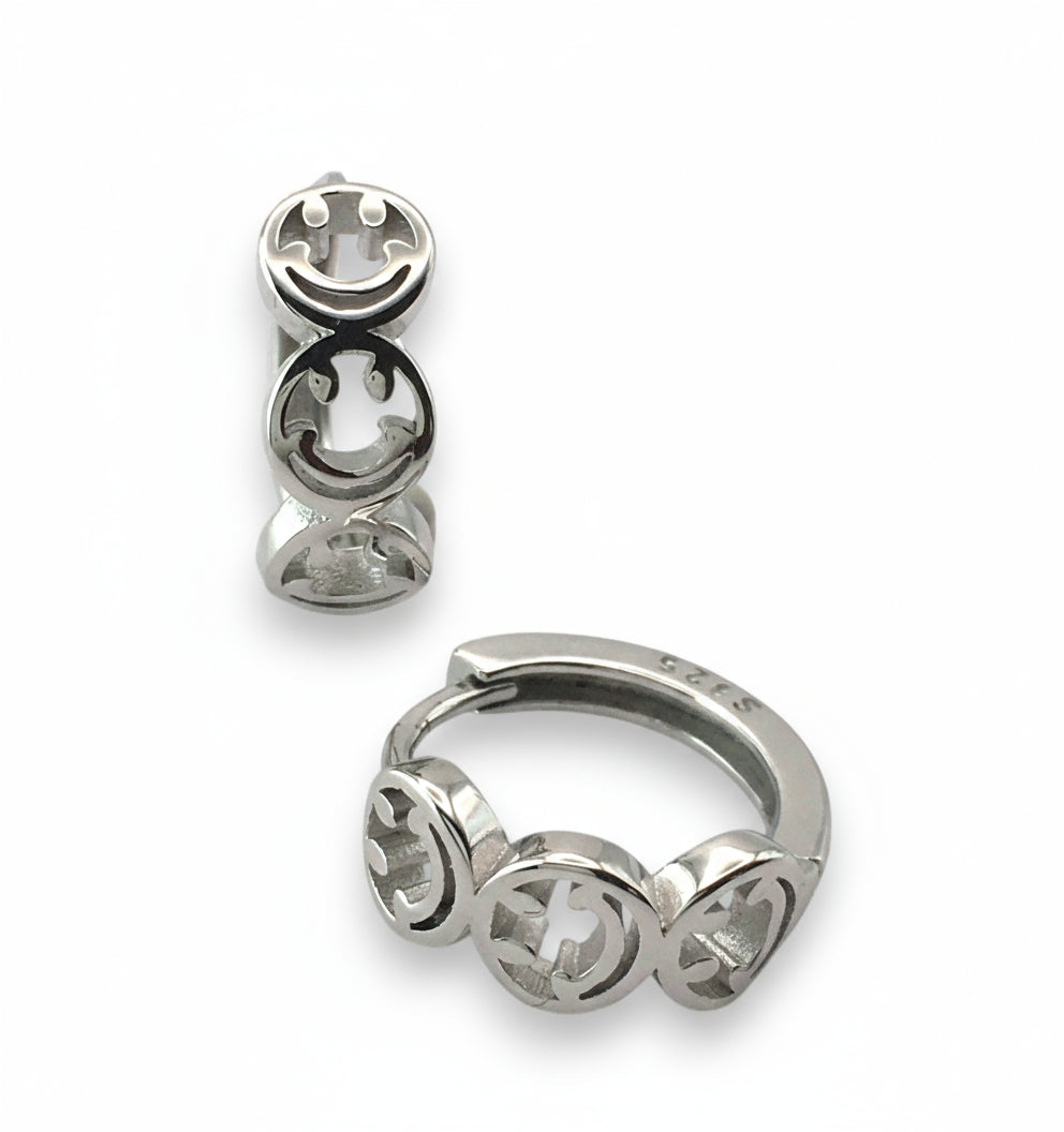 Silver hoop earrings with star symbol design on a white background