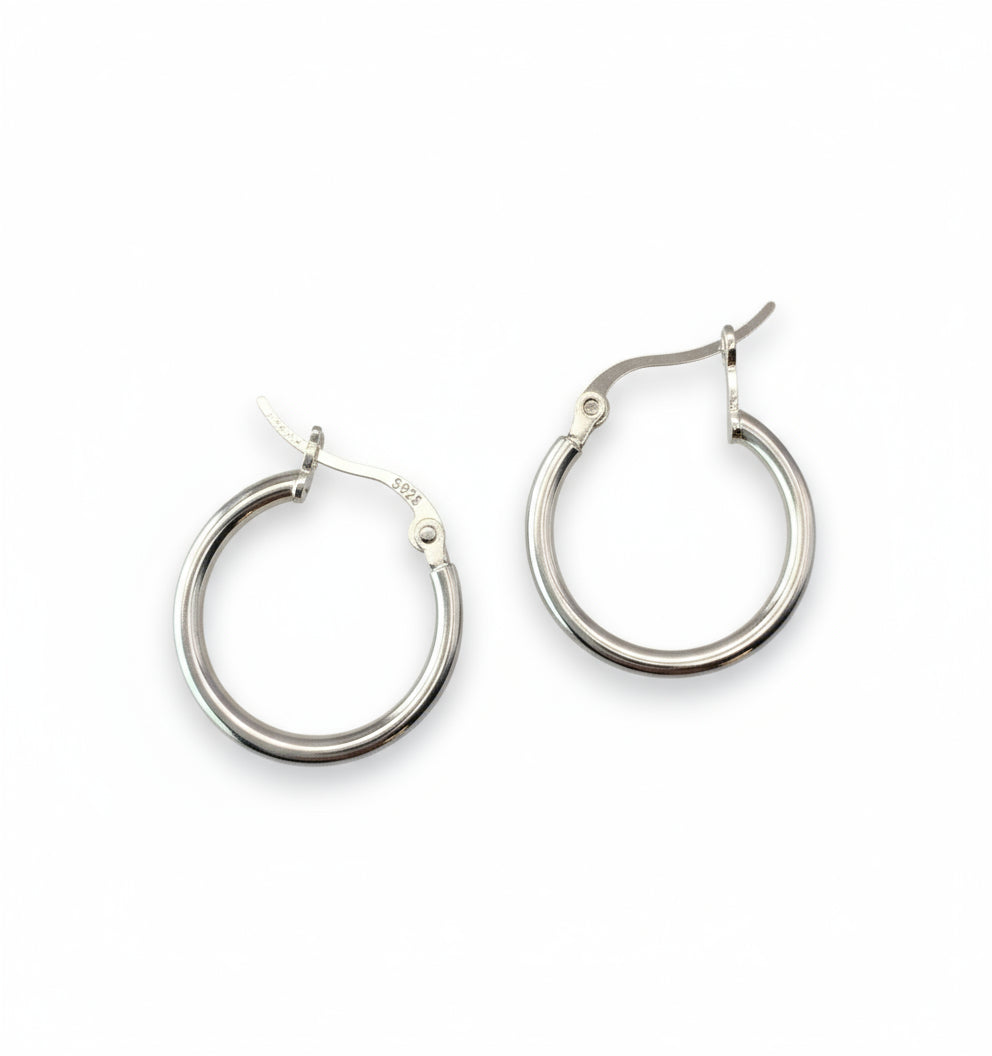 Pair of silver hoop earrings on a white background
